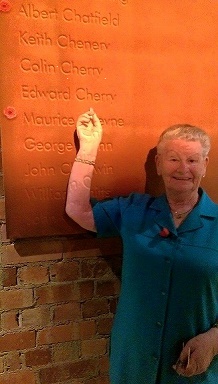 Mum pointing out Dad's name at Shrine.jpg
